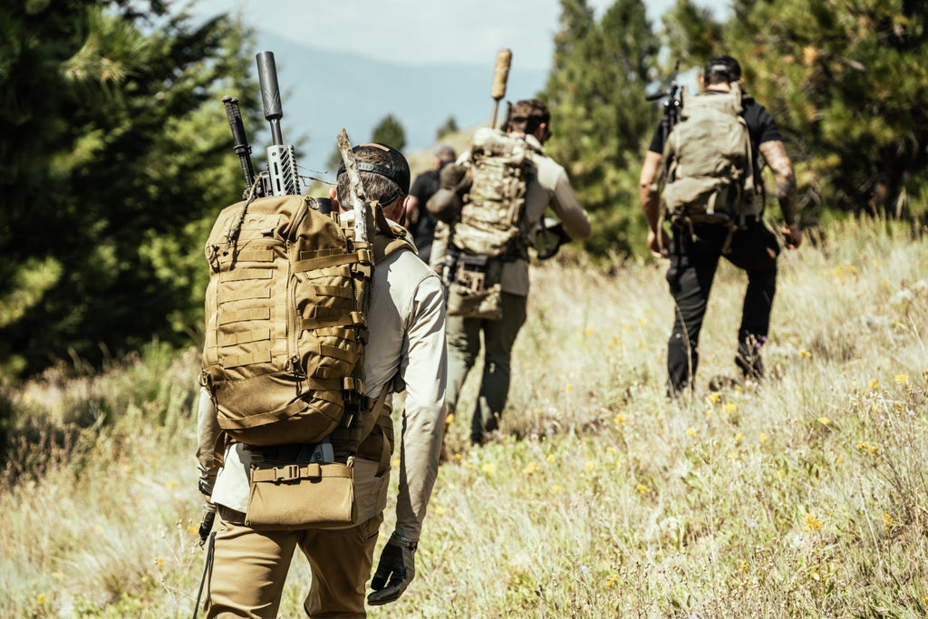 Soldier carrying an Eberlestock pack with integrated rifle scabbard in the field